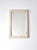 Antique wood frame mirror featuring beveled glass and a creamy white, crazed painted finish that creates a layered,...