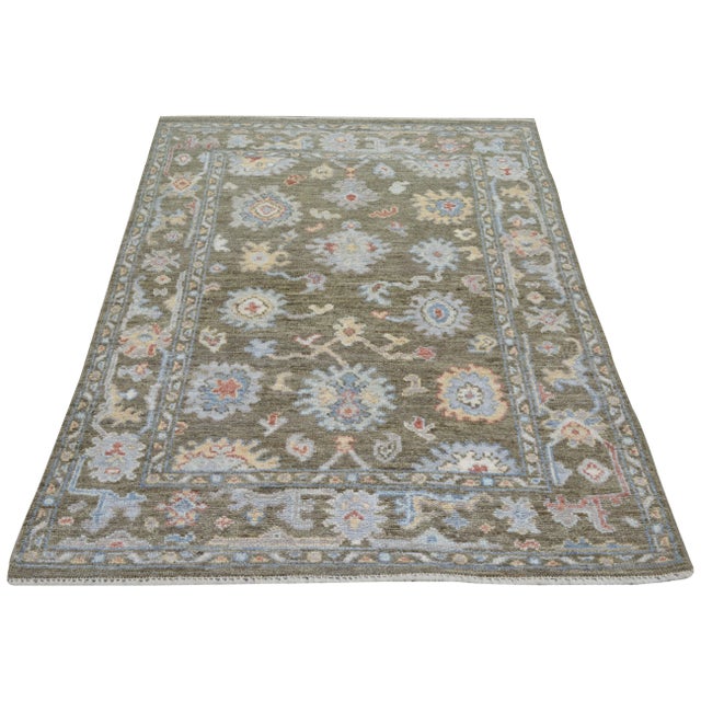 Hand-knotted with care using traditional rug making techniques, this wool rug blends timeless craftsmanship with a modern...