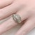 This platinum diamond ring is on the cusp of the Edwardian and Art Deco eras. The centerpiece of the ornate ring are three...