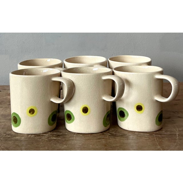 This charming set of six vintage coffee mugs captures the whimsical yet sophisticated spirit of Mediterranean artisanal...