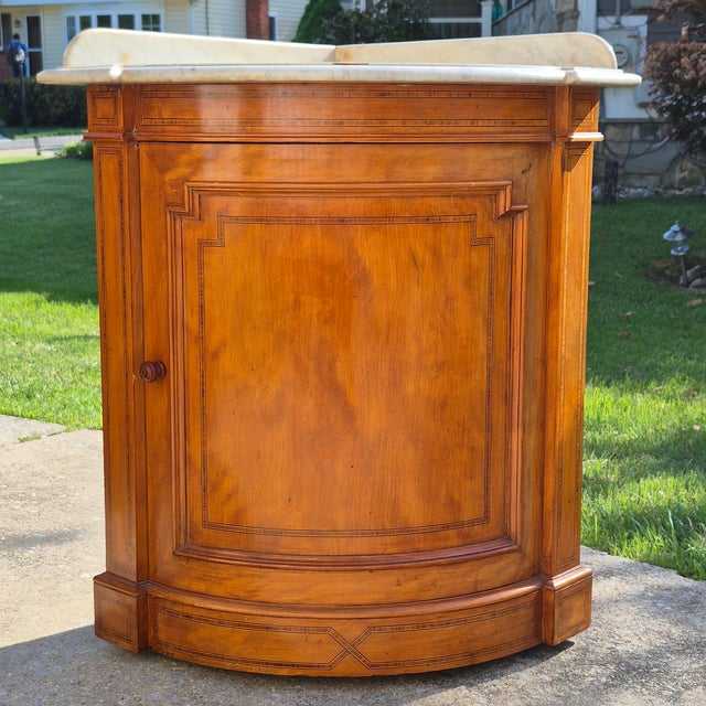 This is an unusual and beautiful antique English corner washstand or cabinet, dated circa 1880. It was purchased at an...