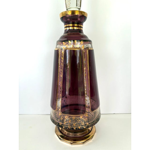 Stunning Bohemian Moser crystal decanter crafted in deep amethyst glass and richly decorated with 24-karat gold hand-...