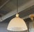 This elegant, early 20th century pendant light features a 10" height ribbed milk glass dome shade with scalloped edge...