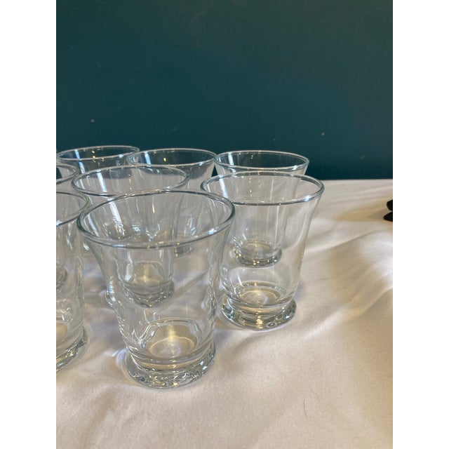 This vintage finds set of 12 clear glass juice tumblers by Anchor Hocking features a timeless tapered design with a sturdy...