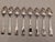 A lot of 8 sterling silver teaspoons by Towle Silversmiths in the "Benjamin Franklin" pattern, which depicts the forever-...