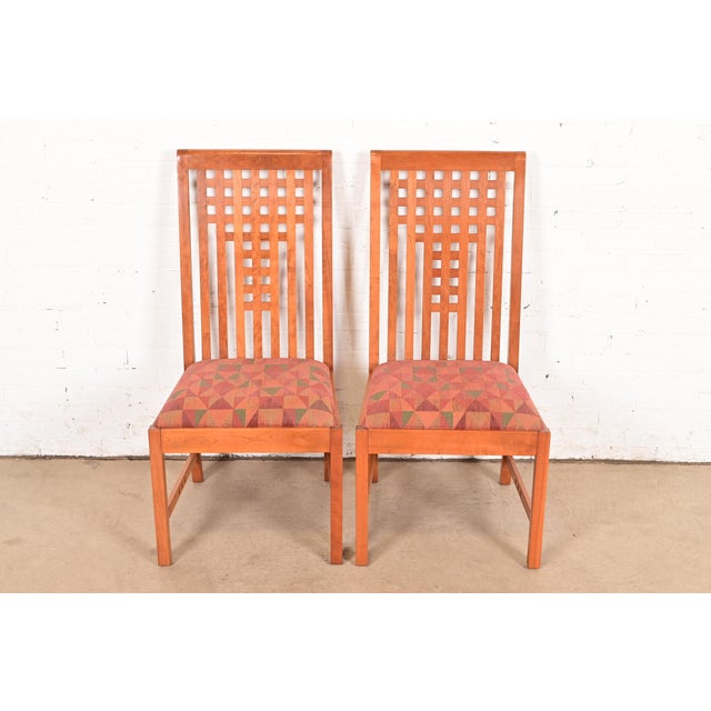 An exceptional pair of Mission or Arts & Crafts style side chairs or dining chairs In the manner of Frank Lloyd Wright By...