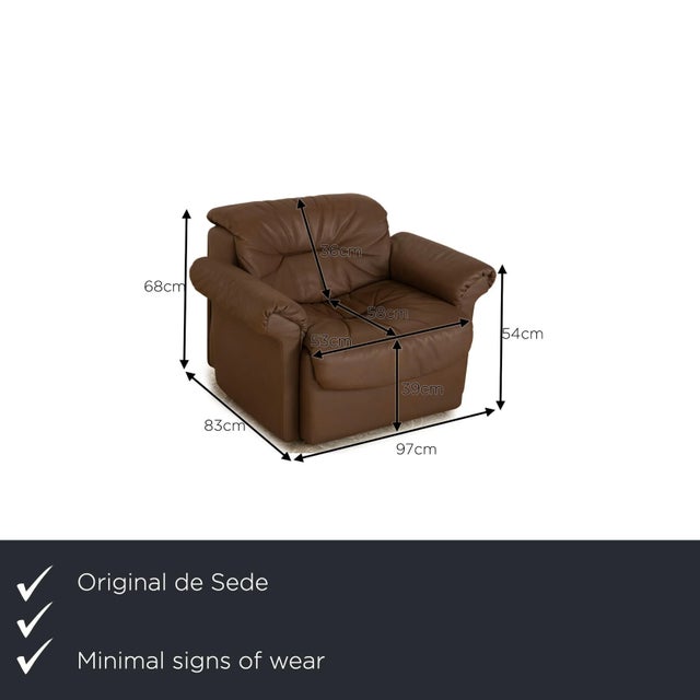 The armchair from de Sede is covered in brown genuine leather and stands on simple feet. It is characterized by its...