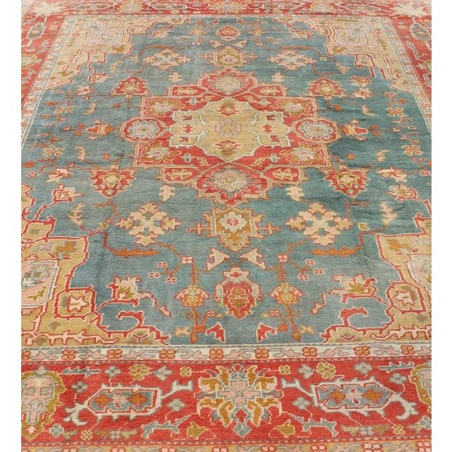 Early 20th Century Antique Turkish Oushak Rug on a Blue Background and Orange-Red Color Border For Sale - Image 5 of 12