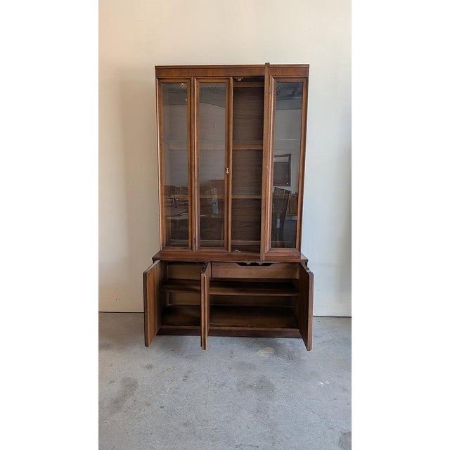 An iconic vintage Mid-Century Modern Brasilia hutch by Broyhill Furniture Co. - one of the most recognizable and...