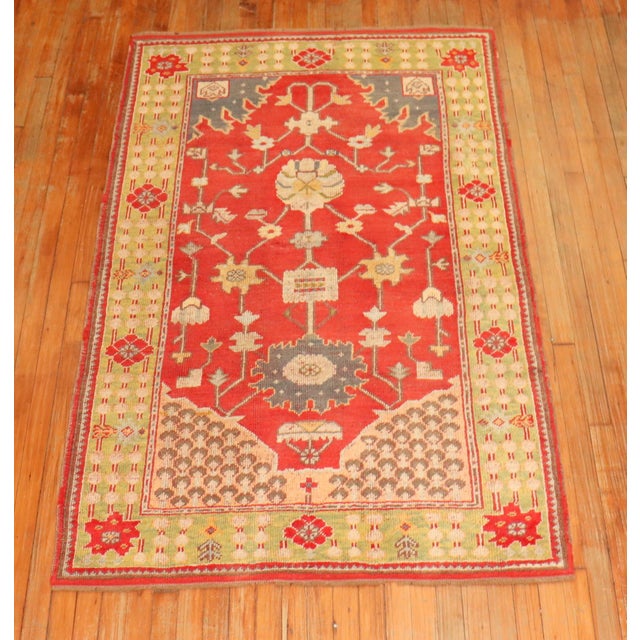 Charming early 20th century colorful turkish oushak rug with a bright red field , lime green border. Measures: 3'11" x 6'3".