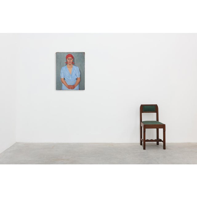 A compelling Expressionist oil on canvas portrait of a woman, painted in Belgium during the 20th century. The sitter is...
