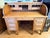 A handsome antique roll top desk crafted in solid quarter-sawn oak with a rich warm honey finish. The tambour lid locks...