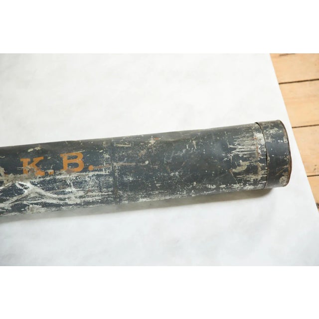 Metal tube used on ships to store maps.