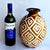 Offered is a hand decorated Peruvian ceramic vase made at the Chulucanos studio in Peru and signed "Luis Salas - 2003"....