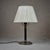 Very nice table lamp by Harald Notini for Böhlmarks. Nickel-plated base and the steam in black-stained wood and pleated...