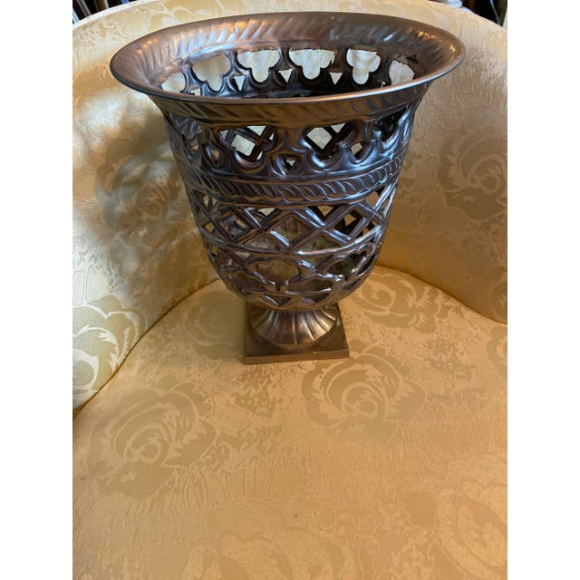 Nice Scroll Design Metal Vase Planter in a Silver Tone Color . Urn Style with a great design .
