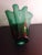 This is a Green Art Glass 10" Ruffled Edged Handkerchief Vase. Procured at an auction