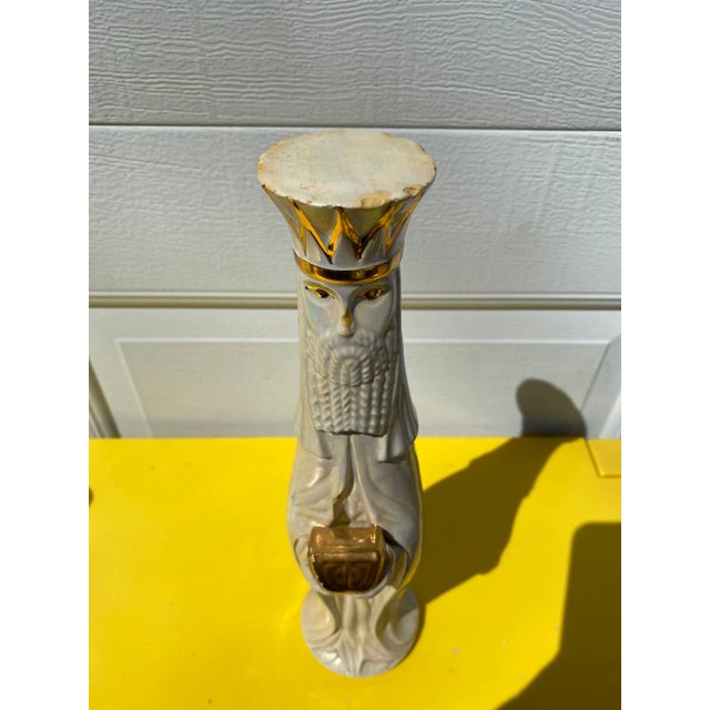 Vintage mid century modern ceramic king figure. Opalescent glaze with gold detail.