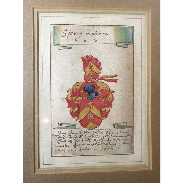 Up for sale is a rare antique original 1603 Latin coat of arms manuscript. This lovely heraldic piece features a hand...