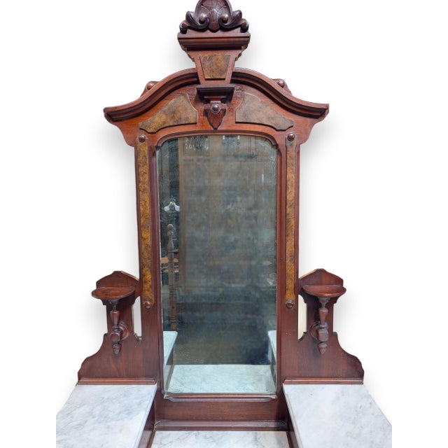 1880's Eastlake walnut with burl walnut mirrored drop center dresser. This piece was manufactured by W. J. Heney & Co., a...