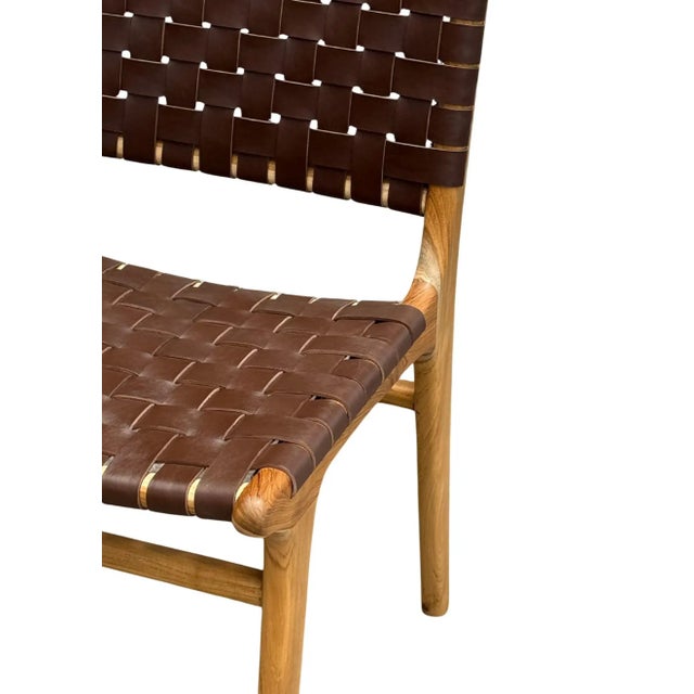 A pair of hand-crafted teak framed & woven leather strap chair. These chairs are crafted by local artisans using a wood...