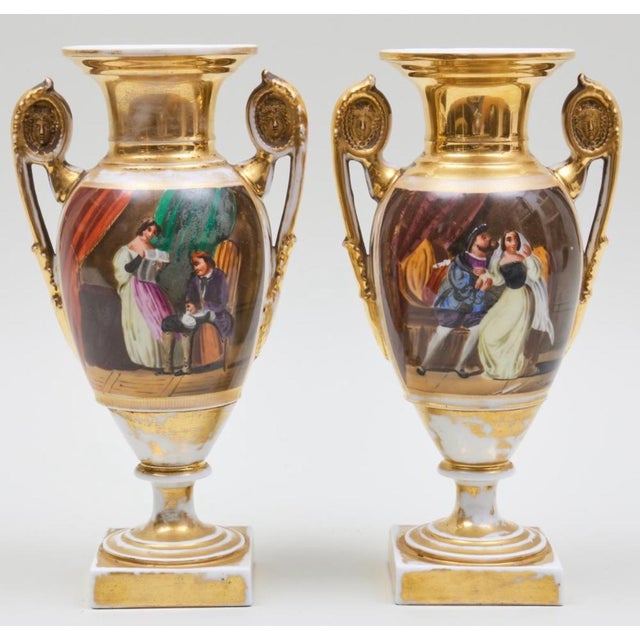 A very impairing pair of 19thc French old Paris empire porcelain vases. Decorated with interior screens and country scenes