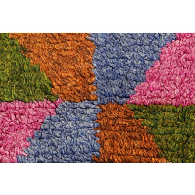 Hand-knotted in wool and originating from Turkey circa 1950-1960, this 4x6 vintage Tulu rug is an extremely rare piece...