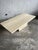 A refined italian coffee table crafted in solid travertine, dating from the 1970s. This piece showcases the natural beauty...