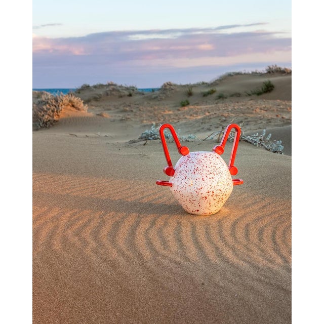 Nestoris decorative vase in red marbled ceramic by stella orlandino dimensions: d 29 x w 29 x h 32 cm. Materials: ceramic....