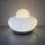 Electra table lamp by Giuliana Gramigna for Artemide, 1968. Glass table lamp with large round base in white glass and a...