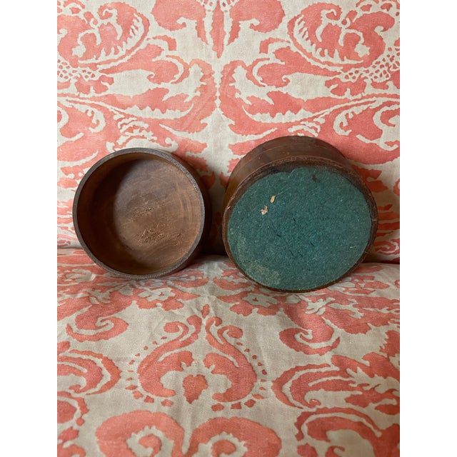 Fun turned wood box with a brass knob on the lid. This lovely turned piece gives the illusion of multiple pieces stacked...