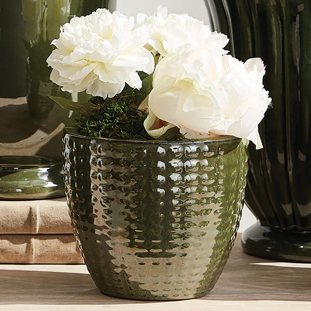 This set of earthenware pots are designed for the outdoors, but are equally as beautiful indoors. From the depth of the...