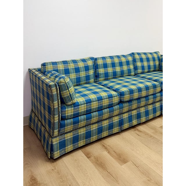 This vintage retro sofa brings bold, statement-making color into any living space. Upholstered in a striking plaid of...