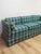 This vintage retro sofa brings bold, statement-making color into any living space. Upholstered in a striking plaid of...