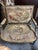Antique French open armchairs in the Louis XVI manner, giltwood frames with rectangular backs, scroll-terminal open arms,...