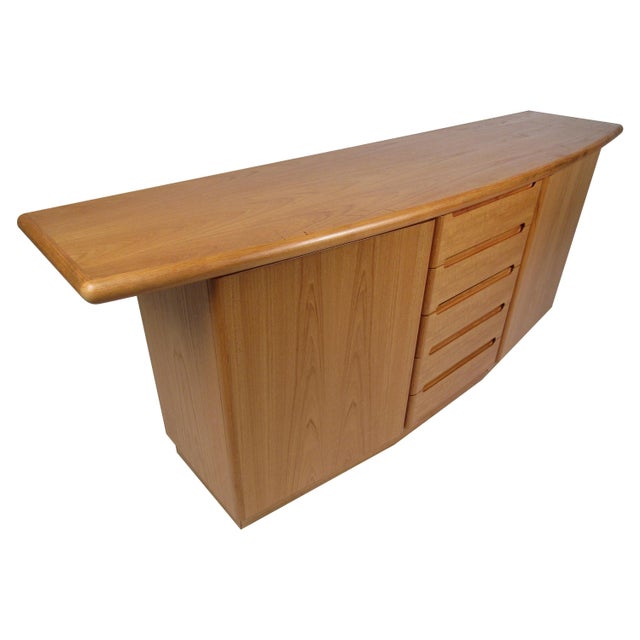 This beautiful vintage Danish server features an overhanging top with a curved front and a rich teak finish. A unique...