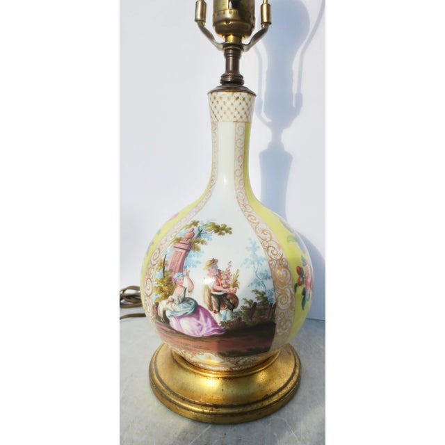 Porcelain Vase from Germany circa 1900. Beautifully painted with a bright yellow body, two primary scenes, and two...