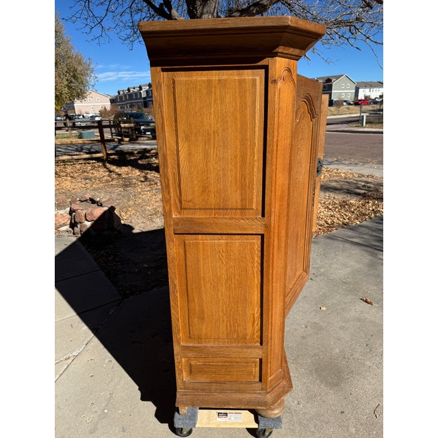 This French Provincial oak armoire, likely crafter between 1880 and 1910, combines craftsmanship with functionality....