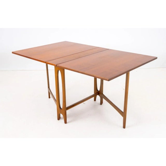 Bendt Winge Mid-Century Modern Teak Drop Leaf Dining Table, apparently unmarked. Leaves dropped: 28.75" H x 35" W x 8" D;...