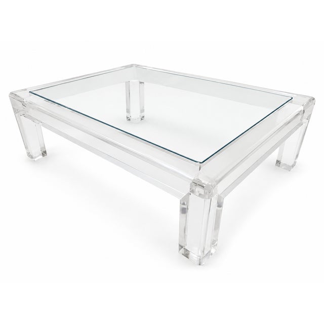 Designed and manufactured in the United States during the 1970s, this stunning Lucite coffee table by Les Prismatiques...