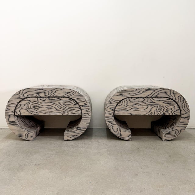 A vintage pair of 1980s Postmodern waterfall nightstands featuring professionally restored original ALPI veneer designed...