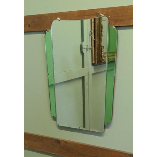 An Odeon Style Art Deco Emerald Wall Mirror. This is an attractive piece it has a central clear glass mirror with wavy...