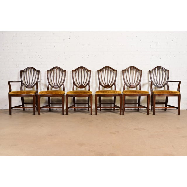 A gorgeous set of six Federal or Hepplewhite style shield back dining chairs By Ethan Allen USA, Circa 1970s Solid carved...