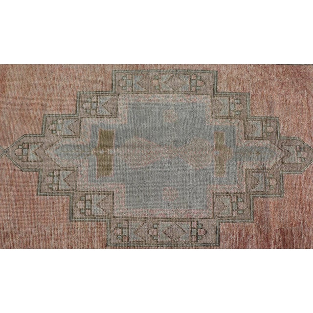 Mid 20th Century Vintage Turkish Oushak Gallery With Tribal Medallions in Soft Peach and Green For Sale - Image 5 of 13