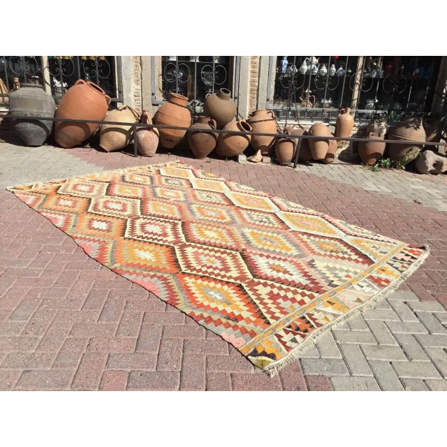This beautiful, vintage, handwoven kilim is approximately 50 years old. It is handmade, of very fine quality hand spun...