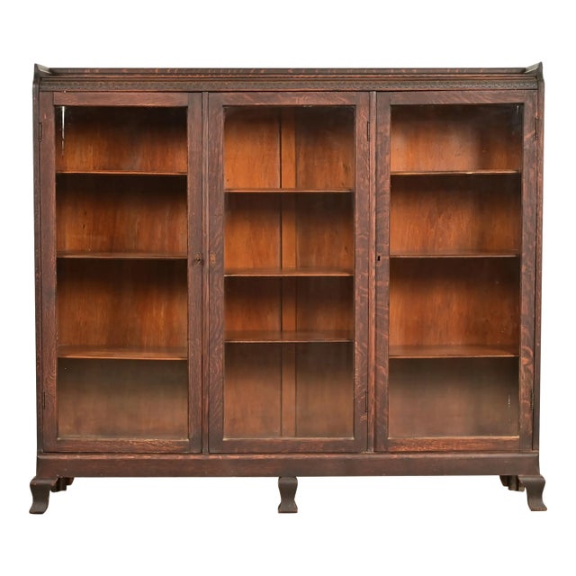 R. J. Horner Style Victorian Carved Oak Glass Front Triple Bookcase, Circa 1890s For Sale