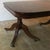 A superb quality English Regency dining table made of solid Cuban flame mahogany supported by two turned pillars/pedestals...