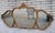 Elegant 1920 French Louis XV-style triple-panel wall mirror featuring a beautifully carved gilded wood frame with graceful...