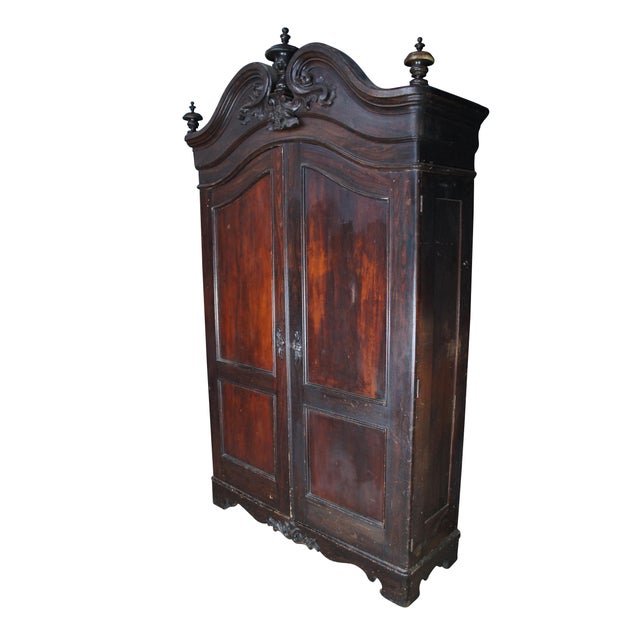 Massive Antique 19th Century American Rococo Revival Wardrobe or linen press. Features a mahogany construction with...