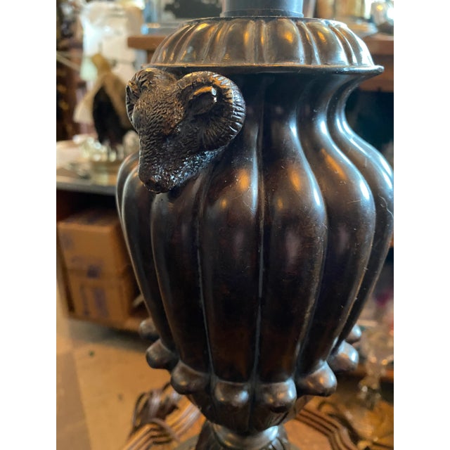 Staiart Lamp with Rams Head on each side. The Lamp is in a Bronze Tone Color with a Slight Gold Tone on the Rams to...